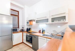 Kuchyňa alebo kuchynka v ubytovaní Great Homes