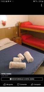 Ένα ή περισσότερα κρεβάτια σε δωμάτιο στο Hotel Hawai