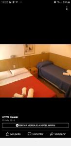 Ένα ή περισσότερα κρεβάτια σε δωμάτιο στο Hotel Hawai