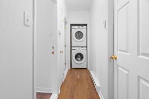 a laundry room with a washer and dryer in it at Chez Dodo Chalet Tremblant 3bdrs condo with fireplace in Mont-Tremblant
