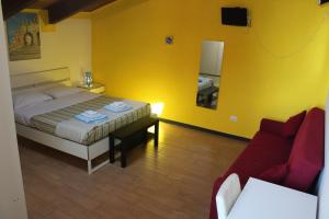 Postel nebo postele na pokoji v ubytování B&B Oasi al Mare