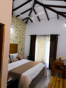 a bedroom with a bed and a wall with animals on it at Air Ray Homestay in Negombo