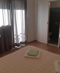 Ένα ή περισσότερα κρεβάτια σε δωμάτιο στο Apartman Andrea