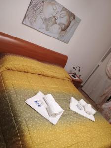 Postel nebo postele na pokoji v ubytování Oasi Blu + 15 fotografií