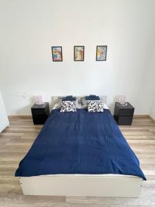 Posteľ alebo postele v izbe v ubytovaní Harmath-Szabó Apartman