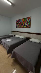 Postel nebo postele na pokoji v ubytování Hotel Brasil