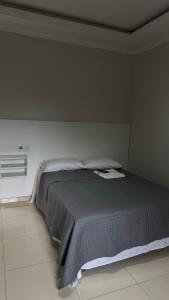 Postel nebo postele na pokoji v ubytování Hotel Brasil