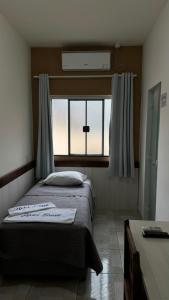 Postel nebo postele na pokoji v ubytování Hotel Brasil + 20 fotografií