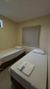 Postel nebo postele na pokoji v ubytování Hotel Brasil