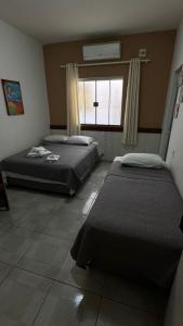 Postel nebo postele na pokoji v ubytování Hotel Brasil