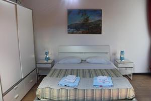 Postel nebo postele na pokoji v ubytování B&B Oasi al Mare