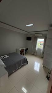 Postel nebo postele na pokoji v ubytování Hotel Brasil