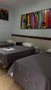 Postel nebo postele na pokoji v ubytování Hotel Brasil