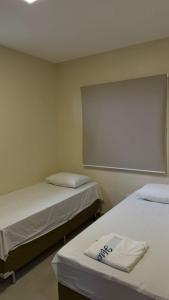 Postel nebo postele na pokoji v ubytování Hotel Brasil