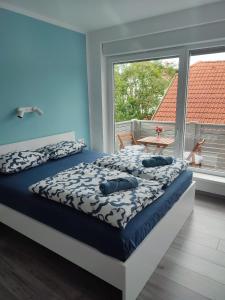 a bedroom with a bed and a large window at Tilka`s house in Blejska Dobrava