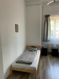 Posteľ alebo postele v izbe v ubytovaní Harmath-Szabó Apartman