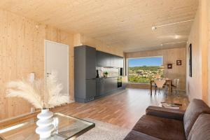 a living room with a couch and a table at 5,1sq mts room -Forests cozy house in Stavanger