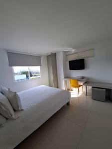 Postel nebo postele na pokoji v ubytování Hotel Mar del Plata