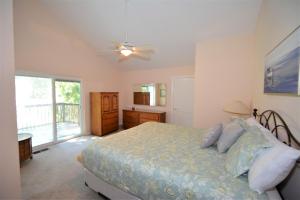 a bedroom with a bed and a ceiling fan at Brummett Lodge in Bass Lake +37 photos
