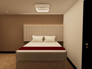 Postel nebo postele na pokoji v ubytování Hotel Continental ByHours