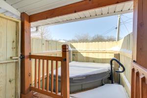 a porch with a bed and a fence at 4 Mi to Lake Logan Hocking Hills Apartment in Logan