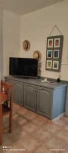 a television on top of a cabinet in a room at Casa Arena Negra Edificio A'costa in Puerto Naos