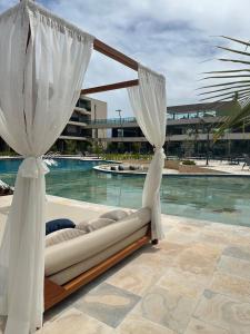 Bazén v ubytování Flat Aconchegante em Muro Alto - Porto de Galinhas nebo v jeho okolí