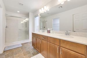 a bathroom with a large sink and a shower at 10 Mi to The Strip Spacious Extended Vegas Stay! in Las Vegas +17 photos