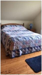 Uma cama ou camas num quarto em Sea views in Dugort