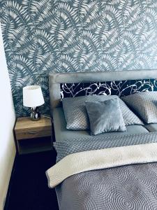 Postel nebo postele na pokoji v ubytování Apartmány na Zahradní