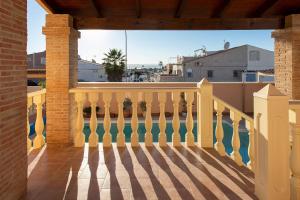 a balcony of a house with a white railing at Villa Deva 20 in Torrevieja