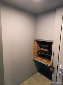 an empty room with a room with a pizza oven at Ale-MardelPlata-Sicilia in Mar del Plata +6 photos