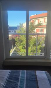 a window in a room with a view of a building at Ale-MardelPlata-Sicilia in Mar del Plata