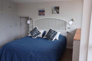 En eller flere senge i et værelse på Villa les Fontaines