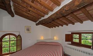 Rúm í herbergi á Al Palazzaccio