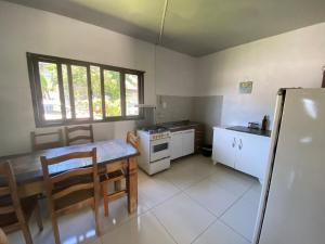 Η κουζίνα ή μικρή κουζίνα στο Simplicidade na melhor localização +16 φωτογραφίες