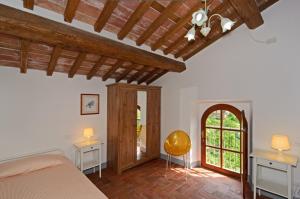 Rúm í herbergi á Al Palazzaccio