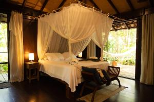Giường trong phòng chung tại Canto Leela Eco Bungalows