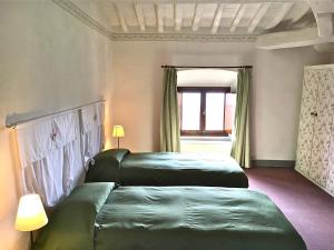 Rúm í herbergi á Al Palazzaccio