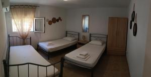 A bed or beds in a room at Evi's home