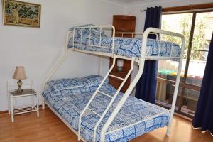 Ένα ή περισσότερα κρεβάτια σε δωμάτιο στο Sunny Nook - Bring your own linen.