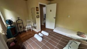 a living room with two beds in a room at Casa Azul in Penha +14 photos