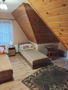 Postel nebo postele na pokoji v ubytování Willa Jakubek Jakub Bobak