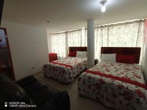 Postel nebo postele na pokoji v ubytování Hotel D'Gloria + 27 fotografií