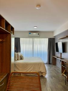 Ένα ή περισσότερα κρεβάτια σε δωμάτιο στο Moon House San Telmo