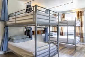 a bedroom with bunk beds in a hostel at Samesun Banff Hostel in Banff