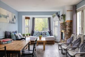 a living room with a couch and a table at Samesun Banff Hostel in Banff