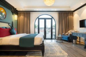 Postel nebo postele na pokoji v ubytování Hanoi Bliss Hotel