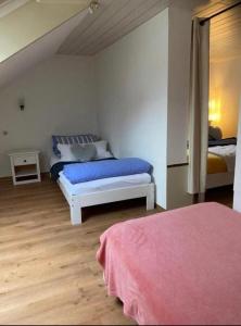 a bedroom with two beds in a room at Ferienhaus am Rhein Koblenz in Koblenz