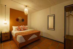 Postel nebo postele na pokoji v ubytování Tres Lagos Hotel